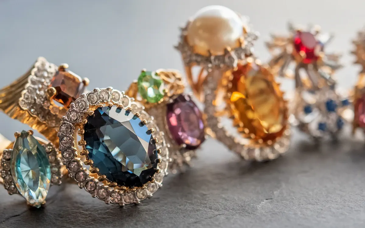 An assortment of coloured gemstone rings