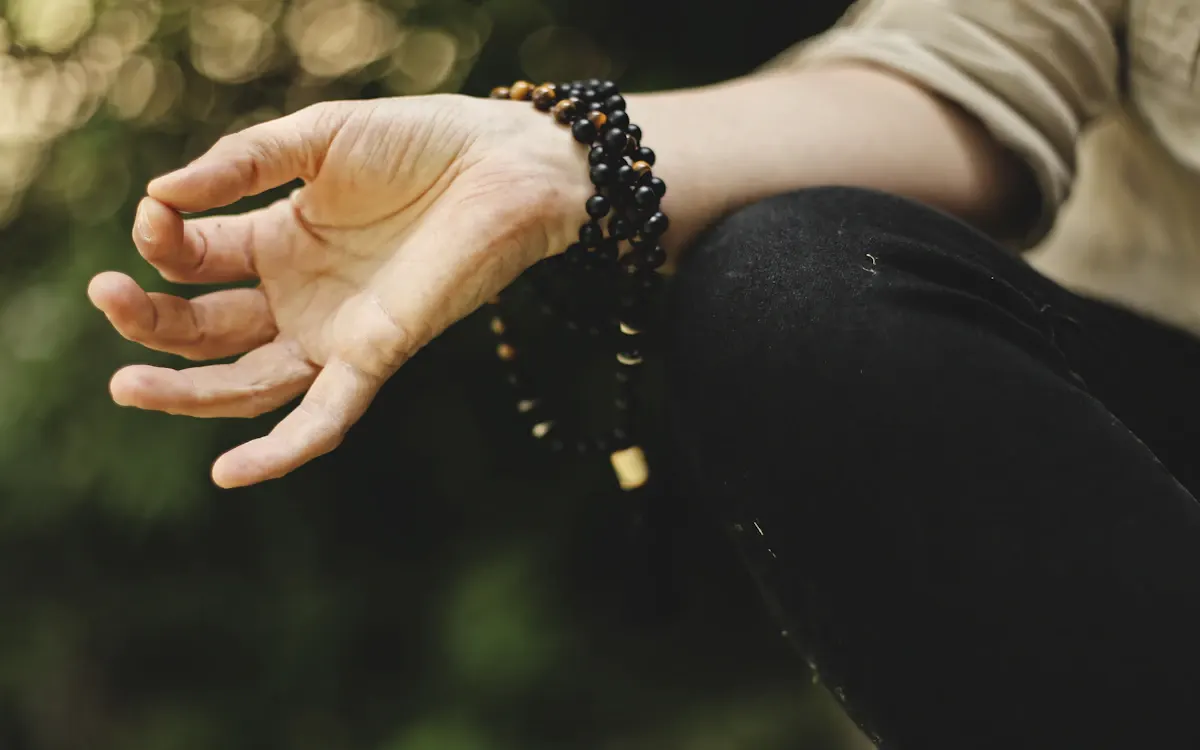 Prayer beads resting on a hand